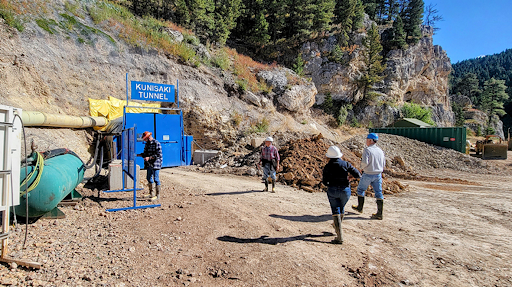 people walking up to a mine